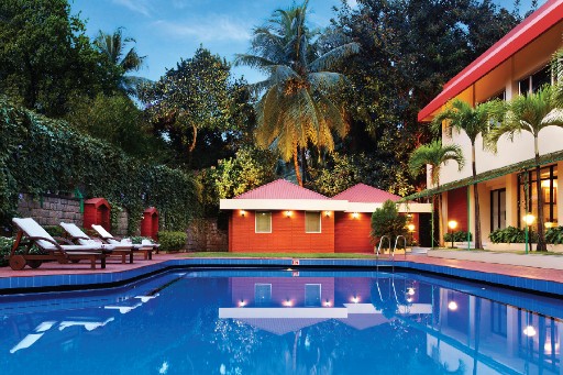 Relax and unwind by the pool at The Gateway Hotel